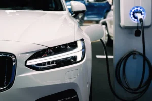 A white hybrid electric car at a charging station in Springfield, IL.