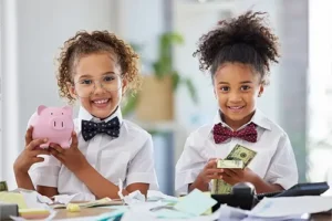 JLW TAX & BOOKKEEPING SERVICES - Children with cash and a piggy bank symbolizing the budget for a small business in Springfield, IL.