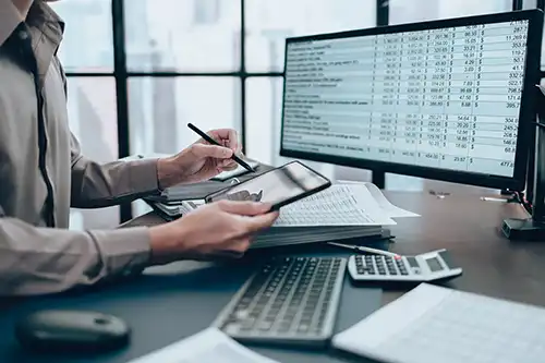 JLW Tax & Bookkeeping Services—A professional consultant reviews financial reporting in an office in Springfield, IL.