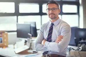 JLW Tax & Bookkeeping Services—A professional accountant stands by his desk in Springfield, IL.
