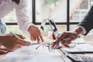 JLW Tax & Bookkeeping—Tax consultants going over bookkeeping and accounting documents in Springfield, IL.)