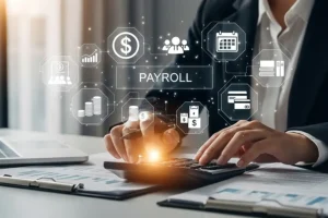 JLW Tax & Bookkeeping Services —a digital representation of payroll as a person works figures out on a calculator in Springfield, IL